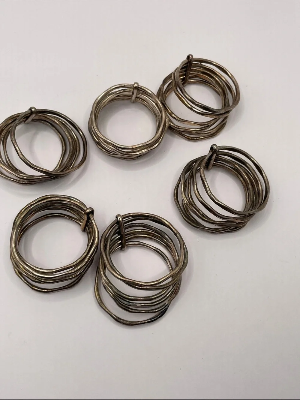 Set of 6 Metal Napkin Rings Tarnished Crome in color